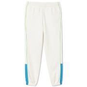 Pantalon Lacoste PANTALON DE SURVÊTEMENT REGULAR FIT EN PIQUÉ BLANC