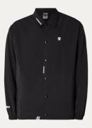 Aape Jack met steekzakken en logo