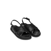 Sandales plates en cuir tressé Adelash