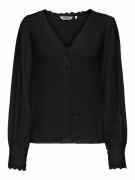 Blouse col v détail broderie